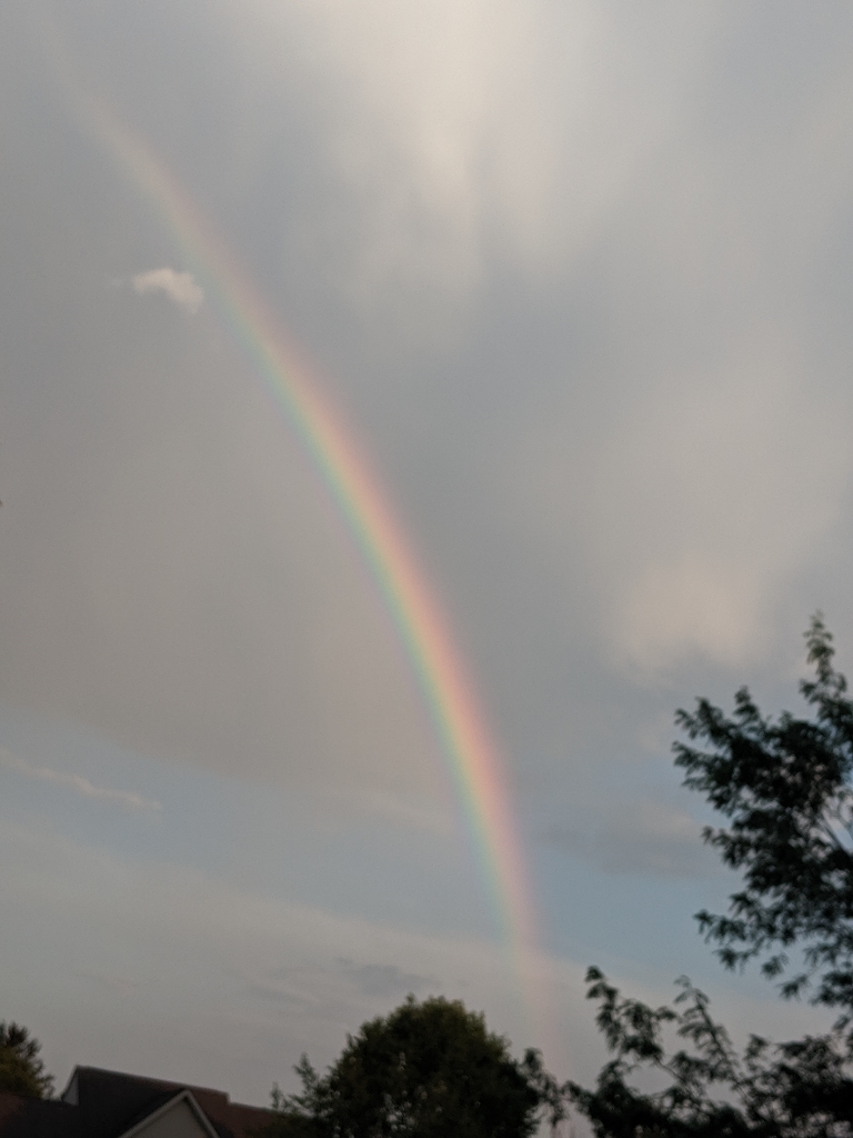 This picture shows a very vivid double rainbow.