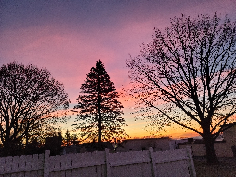 This is a picture of the sunrise. The clouds are orange and pink and are very vividly colored