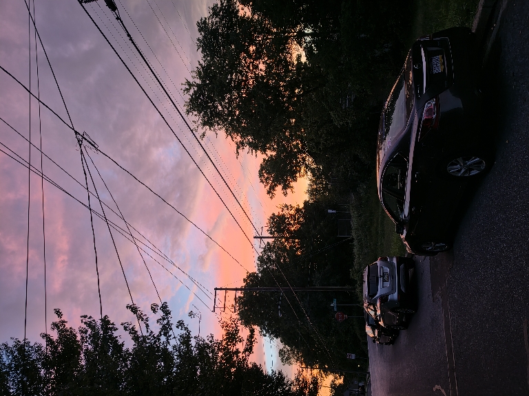 Here is a photo of some very brightly colored clouds around sunset. There are oranges, pinks, and purples.