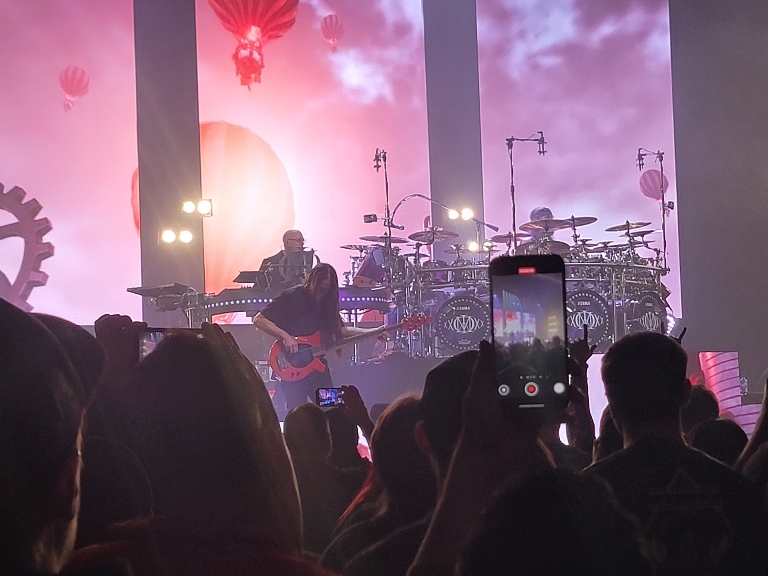 This picture several of the Dream Theater's band members playing on stage