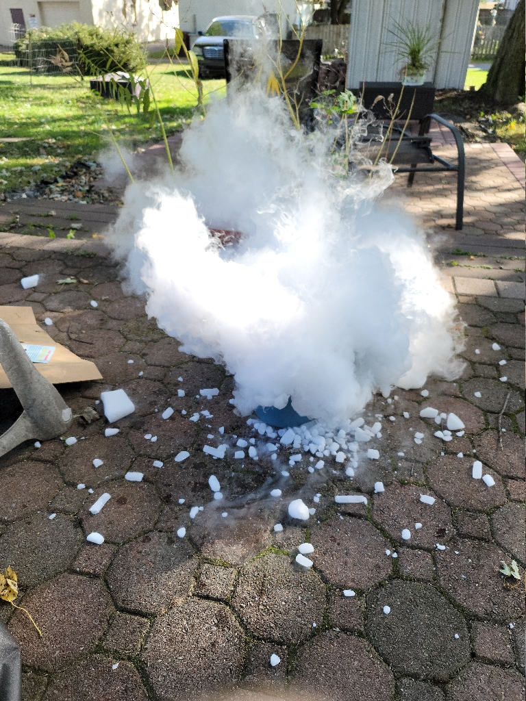 This is a picture of a thick cloud coming from pieces of dry ice after I had poured hot water on it.