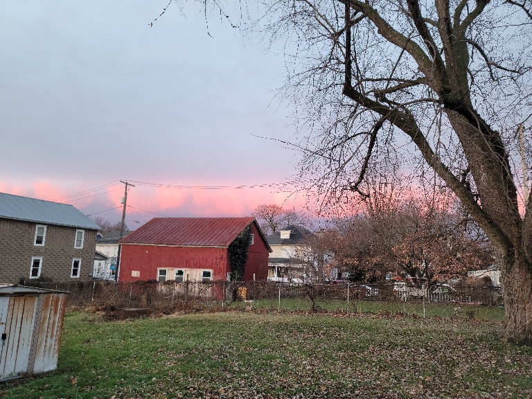 This is a picture of clouds illuminated by the sunrise. They are shades of pink and orange