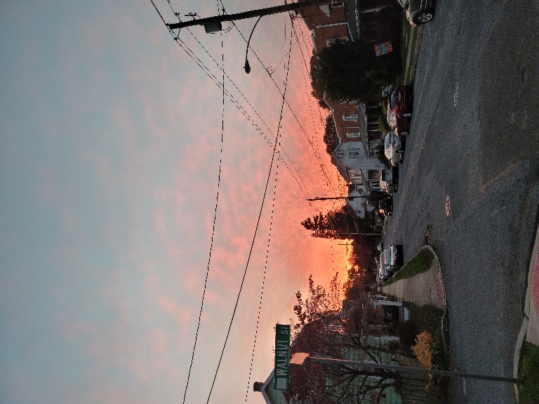 This picture is of a sunset. The sky around the western horizon had various shades of oranges and reds.