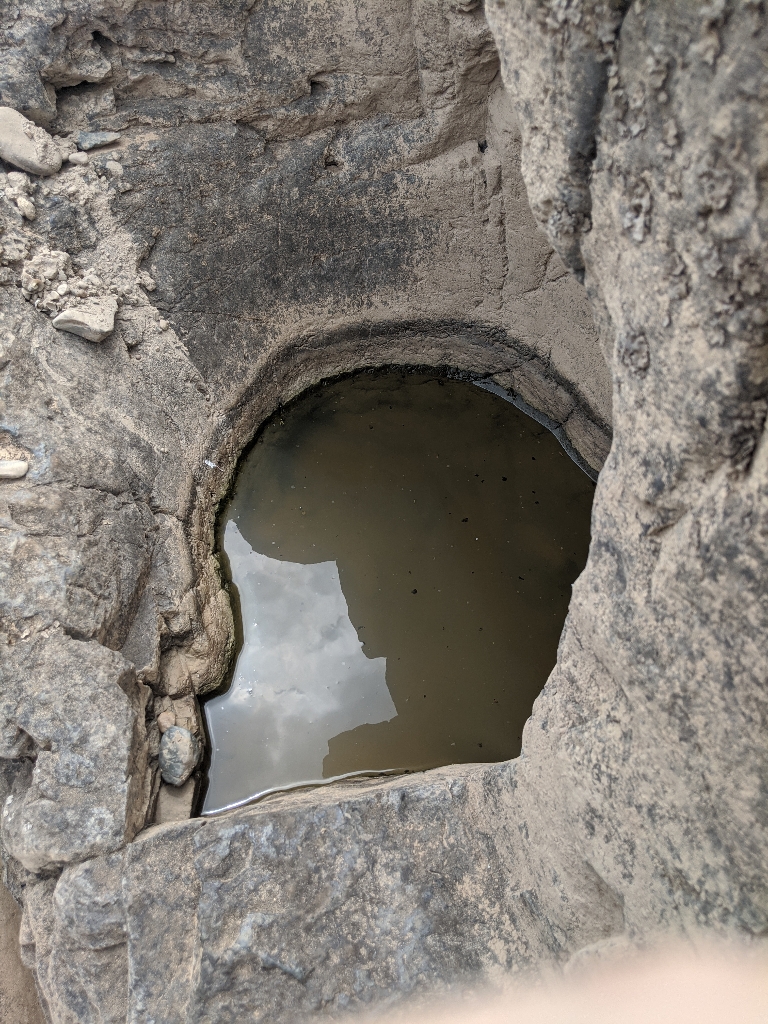 This is a picture showing bigger potholes in rock from the erosive action of the river.