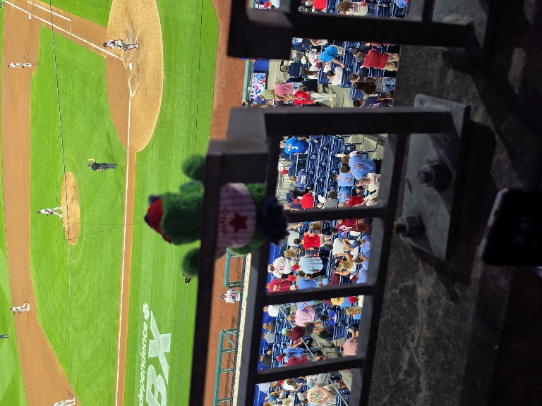 Little Phanatic magnetically stuck to the railing cheering for the Phillies.