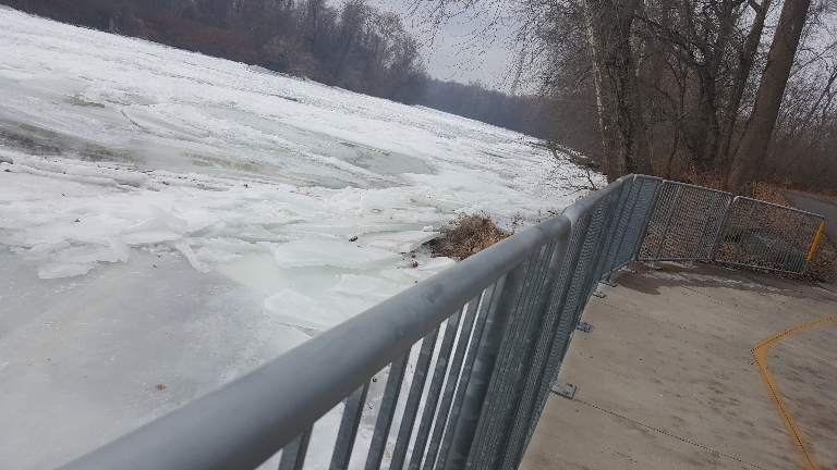 This is a photo looking upstream from the railroad bridge showing lots of ice on the Susquehanna River.