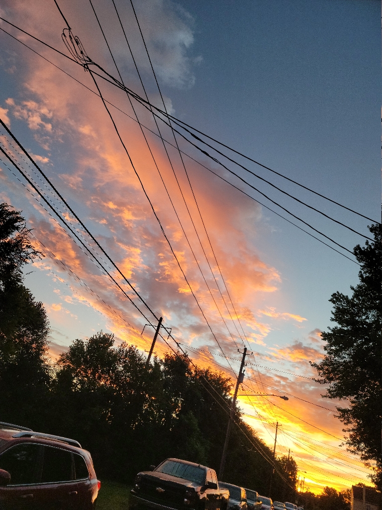This is a picture of clouds of various colors just before sunrise.
