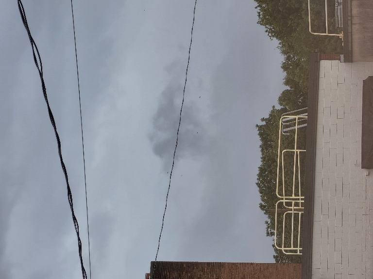 This picture shows various parts of an of the clouds of a departing thunderstorm.